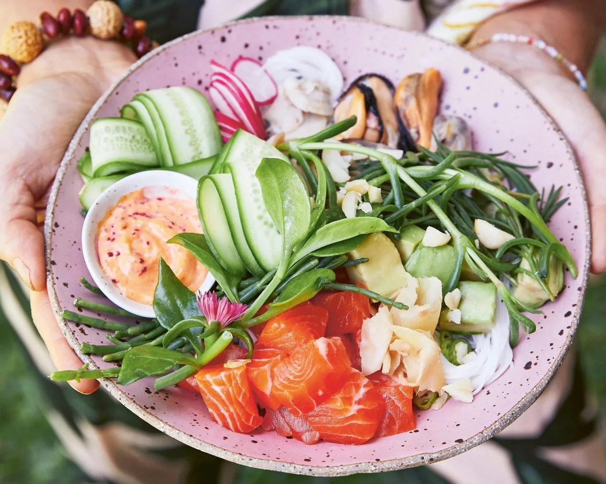 Native inspired poke bowl with salmon and sea greens